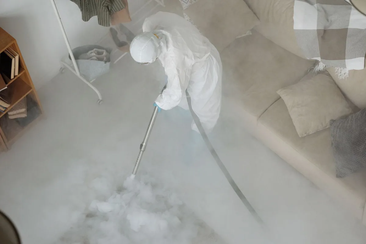 Biohazard cleanup technician in protective equipment, Hunter, TN
